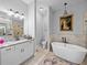 Bathroom featuring double vanity, granite countertop and sleek black hardware and lighting at 3985 Mammoth Grove Rd, Lake Wales, FL 33898