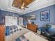 Spacious bedroom with stylish wooden ceiling, laminate floors and view to wall-mounted television at 3985 Mammoth Grove Rd, Lake Wales, FL 33898