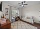 Bedroom with a ceiling fan, dresser with vanity, and cozy daybed perfect for relaxation at 3985 Mammoth Grove Rd, Lake Wales, FL 33898
