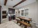 Dining area featuring wooden support beams and a rustic picnic table at 3985 Mammoth Grove Rd, Lake Wales, FL 33898