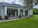 Charming front porch with classic rocking chairs and brick-detailed support pillars at 3985 Mammoth Grove Rd, Lake Wales, FL 33898