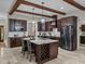 Spacious kitchen featuring granite countertops, stainless steel appliances, and dark wood cabinets at 3985 Mammoth Grove Rd, Lake Wales, FL 33898