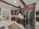 Well-equipped kitchen with dark cabinets, stainless steel appliances, and granite countertops at 3985 Mammoth Grove Rd, Lake Wales, FL 33898