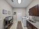 Laundry room with cabinets, shelving and a washer and dryer at 3985 Mammoth Grove Rd, Lake Wales, FL 33898