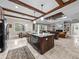 Open floor plan showcases an island, a picnic table and a cozy living room with fireplace at 3985 Mammoth Grove Rd, Lake Wales, FL 33898