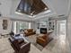 Spacious living room with fireplace, built-in shelves, and dark-wood ceiling at 3985 Mammoth Grove Rd, Lake Wales, FL 33898