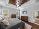 Comfortable main bedroom featuring a decorative wood ceiling, neutral color palette and two windows at 3985 Mammoth Grove Rd, Lake Wales, FL 33898