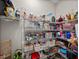 Well-stocked pantry with wire shelving and storage baskets, maximizing storage space and organization at 3985 Mammoth Grove Rd, Lake Wales, FL 33898