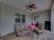 Inviting covered patio featuring a seating area, ceiling fan, and view of the outdoor area at 3985 Mammoth Grove Rd, Lake Wales, FL 33898