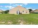 Well-kept backyard offering ample space and privacy behind the home at 4338 Dinner Lake Blvd, Lake Wales, FL 33859