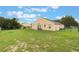 Expansive backyard with well-maintained lawn surrounding the home's exterior at 4338 Dinner Lake Blvd, Lake Wales, FL 33859
