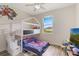 Bright bedroom features a unique bunk bed and playful Spider-Personal decor, bathed in natural light at 4338 Dinner Lake Blvd, Lake Wales, FL 33859