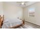 Comfortable bedroom with hardwood floors, a ceiling fan, and ample natural light at 4338 Dinner Lake Blvd, Lake Wales, FL 33859