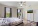 Bedroom with hardwood floors, good natural light, and a walk-in closet at 4338 Dinner Lake Blvd, Lake Wales, FL 33859