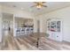 Spacious living room with hardwood floors and an open floor plan to kitchen at 4338 Dinner Lake Blvd, Lake Wales, FL 33859