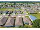 An aerial view of a well-maintained neighborhood with single-Gathering homes and green lawns in a desirable community at 481 Kensington View Dr, Winter Haven, FL 33880
