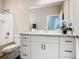 Bathroom featuring a white vanity, a sink, and a combination shower/tub at 481 Kensington View Dr, Winter Haven, FL 33880