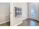 A bathroom features a patterned towel, toilet, and an exterior door for convenience at 481 Kensington View Dr, Winter Haven, FL 33880