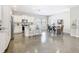 Open-concept kitchen with stainless steel appliances, a center island, and seamless flow to the dining area at 481 Kensington View Dr, Winter Haven, FL 33880