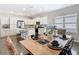 Well-lit kitchen and dining area featuring stainless steel appliances and a view of the dining table at 481 Kensington View Dr, Winter Haven, FL 33880