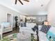 Bright, open-concept living space with views into the kitchen, featuring comfortable seating and stylish decor at 481 Kensington View Dr, Winter Haven, FL 33880
