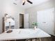 A well-lit office with neutral walls, white storage, and a ceiling fan at 481 Kensington View Dr, Winter Haven, FL 33880