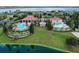 Aerial view of community pool, clubhouse and well-manicured landscaping at 505 Adams View Ln, Auburndale, FL 33823