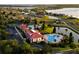 Aerial view of community center with pool, lake and clubhouse at 505 Adams View Ln, Auburndale, FL 33823
