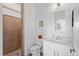 Updated bathroom with tiled shower and a modern vanity with countertop space at 505 Adams View Ln, Auburndale, FL 33823