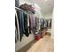Spacious walk-in closet with custom shelving and ample storage for organization at 505 Adams View Ln, Auburndale, FL 33823