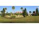 Beautiful community building with palm trees and lake views at 505 Adams View Ln, Auburndale, FL 33823