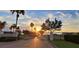 Gated entrance to community with lake views and sunset at 505 Adams View Ln, Auburndale, FL 33823
