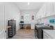Well-lit laundry room with custom cabinets, utility sink and flex space at 505 Adams View Ln, Auburndale, FL 33823