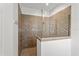 Walk-in shower with tile surround, glass door, and modern fixtures at 505 Adams View Ln, Auburndale, FL 33823