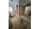 Bathroom with vanity sink, large mirror, shower, and built-in storage at 507 Avenue H Se, Winter Haven, FL 33880