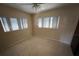 Bedroom with two bright windows and ceiling fan at 507 Avenue H Se, Winter Haven, FL 33880