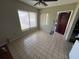 Sunny dining room featuring tile flooring and a ceiling fan at 507 Avenue H Se, Winter Haven, FL 33880