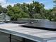 Roof of home shows a solar panel installation with a lush green background on a sunny day at 507 Avenue H Se, Winter Haven, FL 33880