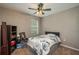 This bedroom features a sports themed fan with carpeted floor and nice natural light at 536 Squires Grove Dr, Winter Haven, FL 33880