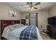 Bedroom with sports themed fan, carpeted floors and neutral color palette at 536 Squires Grove Dr, Winter Haven, FL 33880