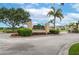 Squires Grove community entrance featuring lush landscaping and a decorative sign at 536 Squires Grove Dr, Winter Haven, FL 33880