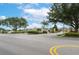 Scenic view of the community entrance with lush landscaping and decorative signage at 536 Squires Grove Dr, Winter Haven, FL 33880