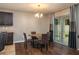 Cozy dining area with a round table and chairs, next to sliding glass doors at 536 Squires Grove Dr, Winter Haven, FL 33880
