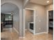 Hallway featuring tile floors leading to the living room, laundry room and bedroom at 536 Squires Grove Dr, Winter Haven, FL 33880