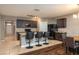 Open kitchen featuring a breakfast bar, stainless steel appliances, and dark cabinetry at 536 Squires Grove Dr, Winter Haven, FL 33880