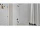 Bathroom featuring a shower/tub combo with tiled walls, a shower curtain, and a shower head at 6528 Sedgeford Dr, Lakeland, FL 33811