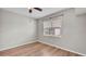 Comfortable bedroom with hardwood floors and window, offering a simple and cozy space at 6528 Sedgeford Dr, Lakeland, FL 33811