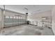 Spacious garage featuring a garage door, bright lights, and plenty of room for parking at 6528 Sedgeford Dr, Lakeland, FL 33811