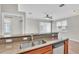 Open kitchen view with a stainless steel sink, granite countertops and stainless steel dishwasher at 6528 Sedgeford Dr, Lakeland, FL 33811