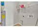 Laundry room featuring shelving, a water heater, and hookups for a washer and dryer at 6528 Sedgeford Dr, Lakeland, FL 33811